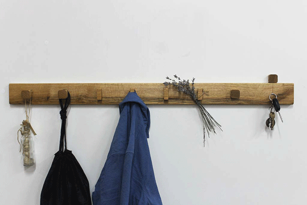 Coat rack with magnetic keys holder and hanger for plant. It is mounted on wall