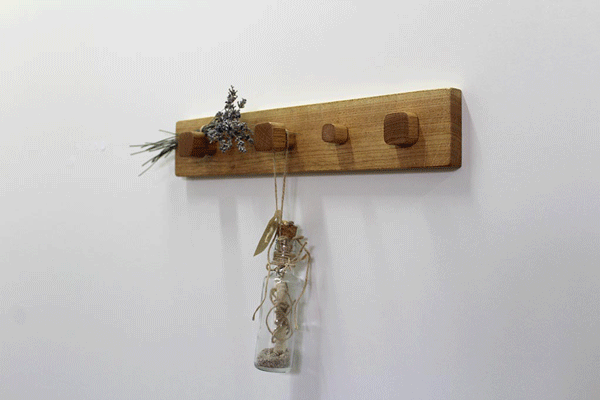 Coat rack "Noel" showing how to use magnetic keys holders. The plank is mounted on wall.