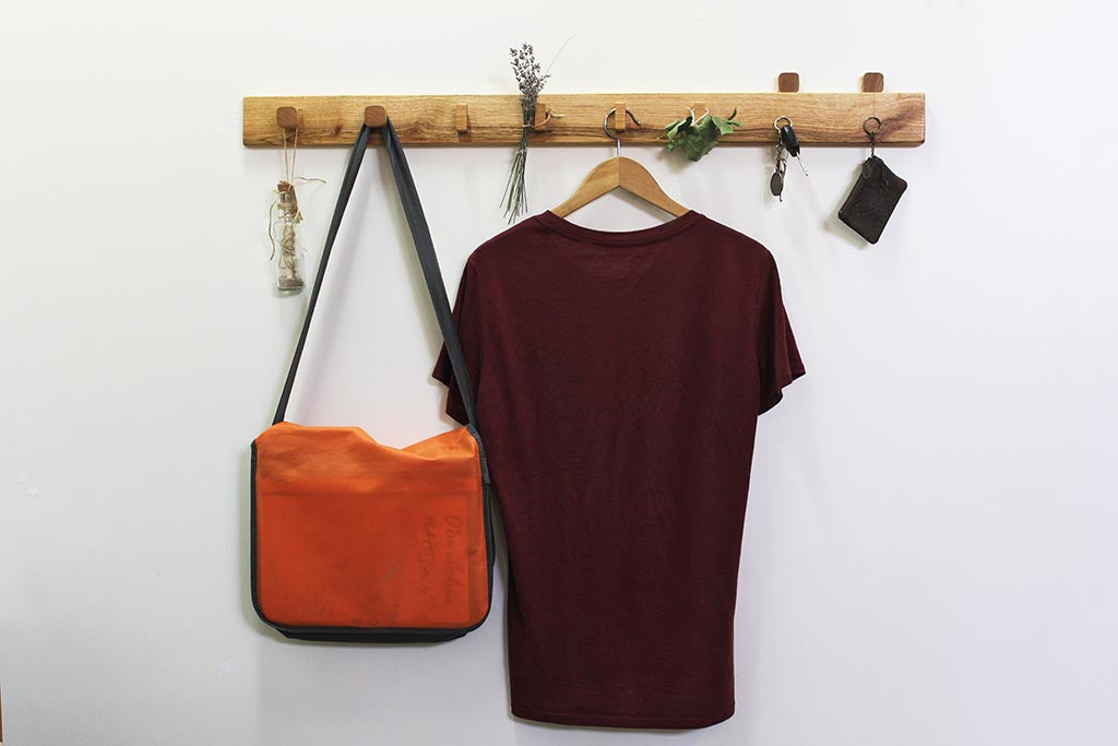 Coat rack with hang clothes and showing how keys holder work
